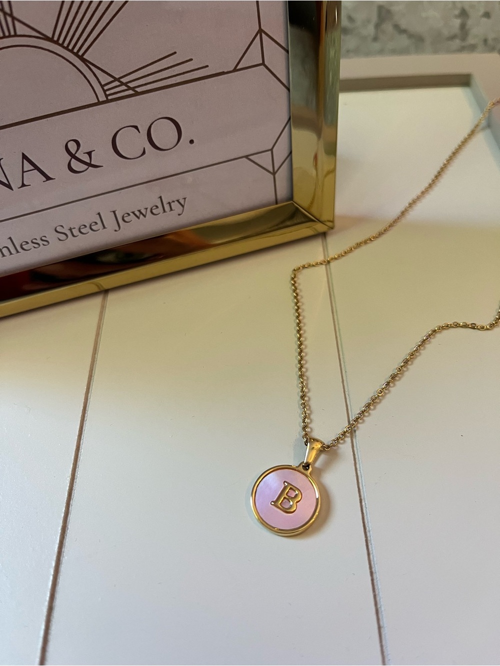 Stainless Steel Gold Initial Necklace Letter “B” with a pink inlay.